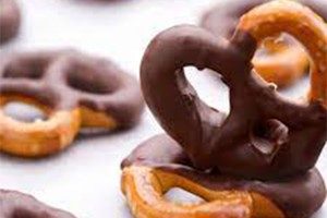 Chocolate coating machine for pretzels